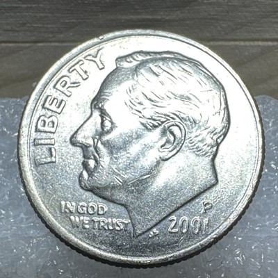 2001 dime rotated die error with reverse design rotated approximately 90 degrees from normal coin alignment