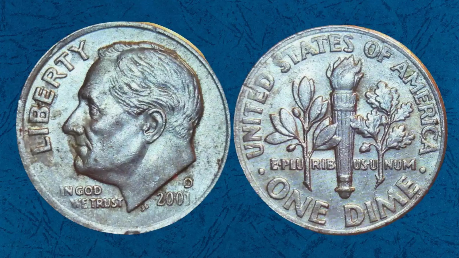 2001 dime struck through grease error showing flat filled-in area on Roosevelt portrait where die grease obscured design
